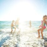 family enjoying in the beach