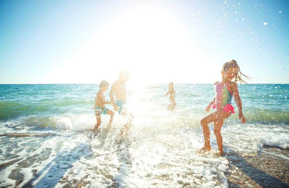 family enjoying in the beach