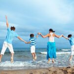 full family enjoying in the beach