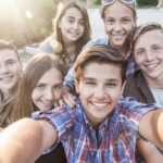 teen friends taking selfie