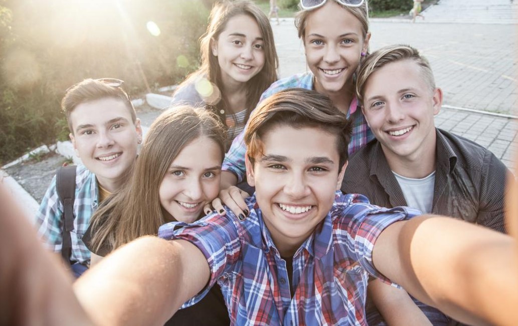 teen friends taking selfie