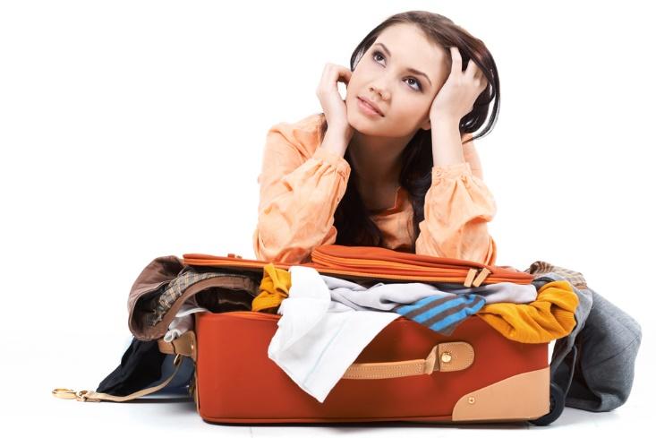 teen girl packing suitcase