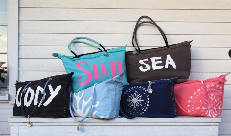 beach bags on a wooden cabinet