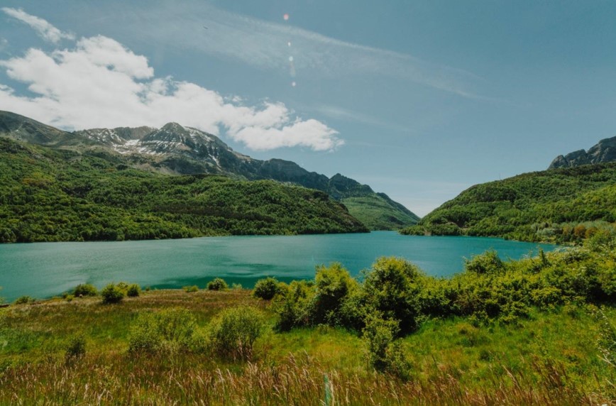 blue lake surrounded by mountains