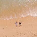 people lying on the beach