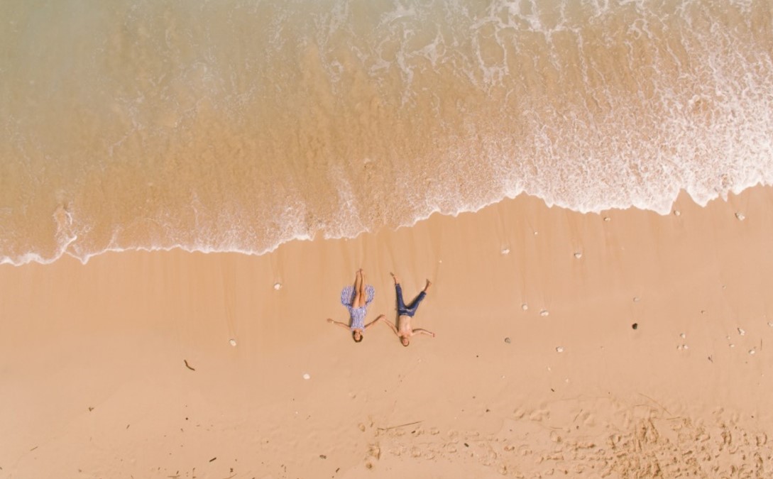 people lying on the beach