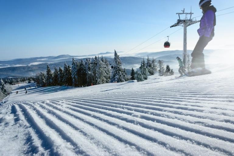 people snowboarding downhill