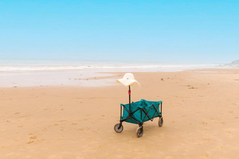 sun hat on a beach wagon handle