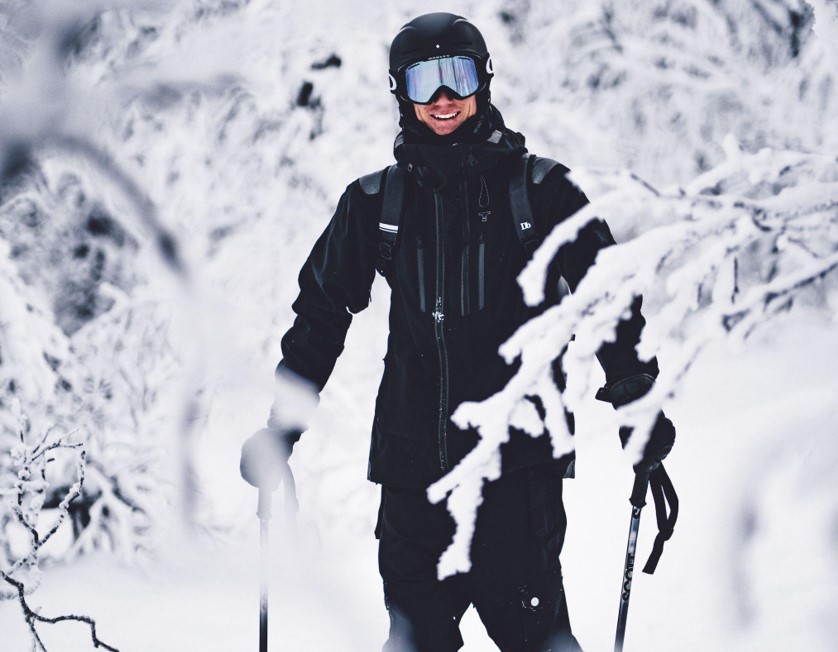 person smiling while skiing