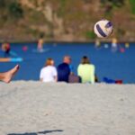 playing football in the beach