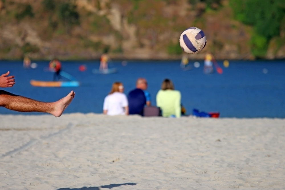 playing football in the beach